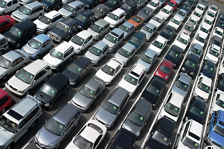 Image of parking lot filled with vehicles